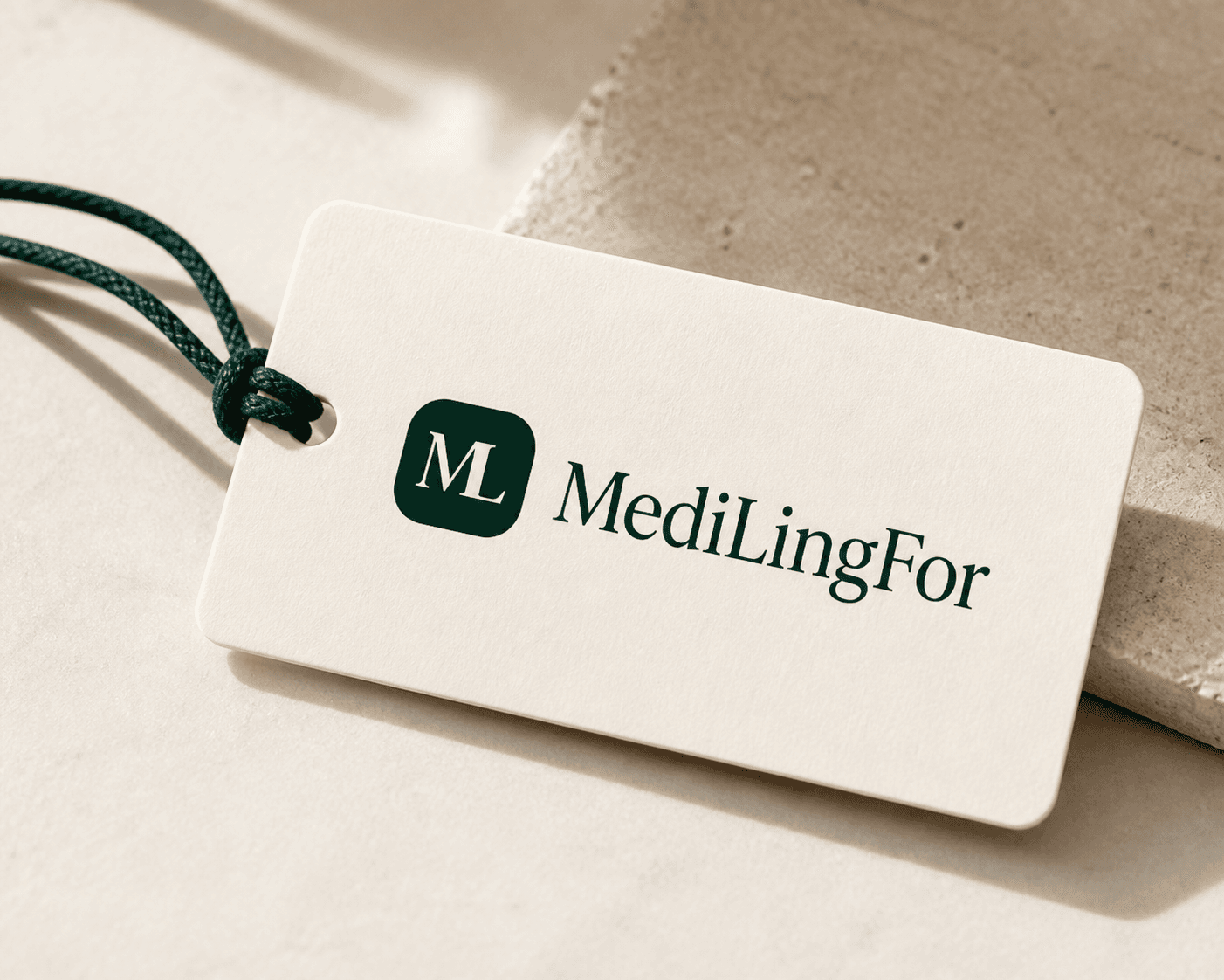 MediLingFor logo printed on a cream tag